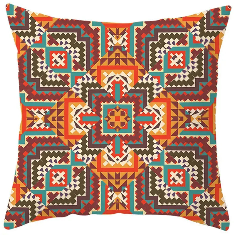 A square pillow cover with vibrant ethnic bohemian geometric pattern in orange teal brown and cream for living room decorbites decor