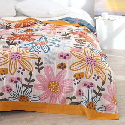 A soft lightweight ethnic cotton blanket with vibrant floral pattern on cream background for decorbites ethnic decor