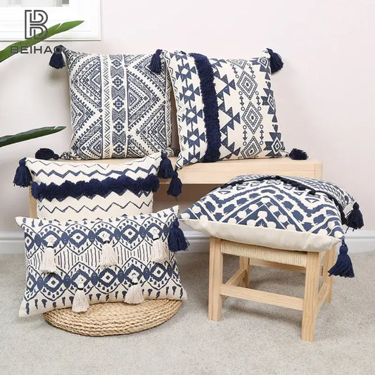 Set of five navy and white ethnic geometric printed cushion cover throw pillows with tassel trim for living room decorbites