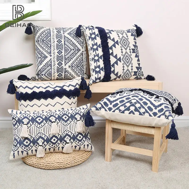 Set of five navy and white ethnic geometric printed cushion cover throw pillows with tassel trim for living room decorbites