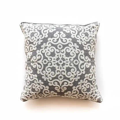 Gray cushion cover with intricate white embroidered ethnic swirl pattern for decorbites ethnic pattern decor