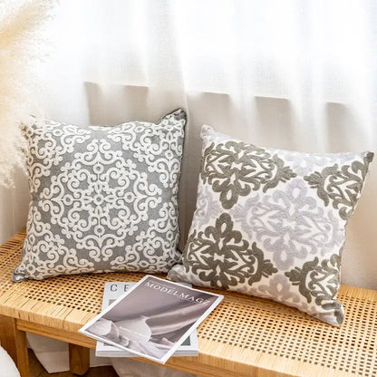 Two square gray and white cushion covers with textured fabric and ethnic pattern for living room decorbites decor