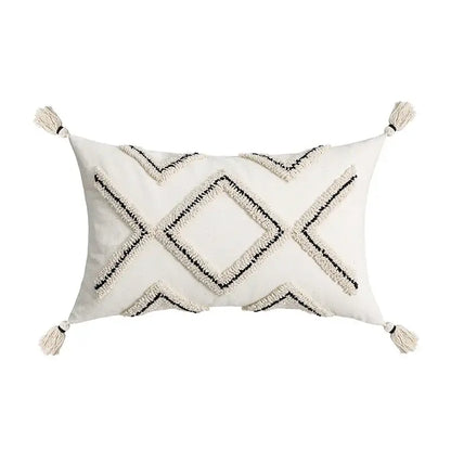 Cream-colored rectangular cushion cover with black geometric embroidery and tassels for decorbites ethnic style black decor
