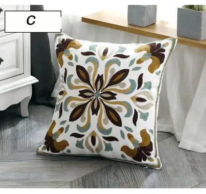 White cushion pillow cover with intricate embroidered floral pattern in brown gold and teal ethnic style canvas decorbites decor