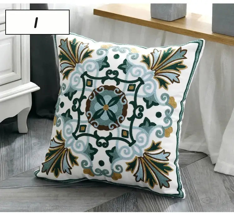 White square pillow cover with intricate embroidered floral and geometric patterns in shades of green blue brown and gold decorbites ethnic style canvas decor