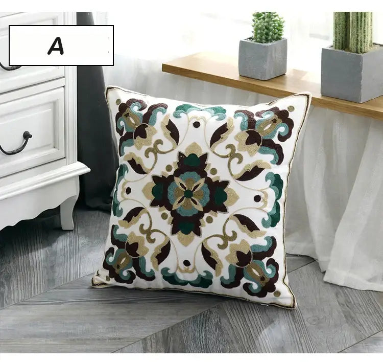 White square ethnic style canvas pillow cover with intricate teal brown and gold floral embroidery for living room decor