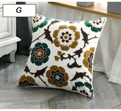 White ethnic style canvas pillow cover with embroidered green brown and gold floral and bird motifs for decorbites decor