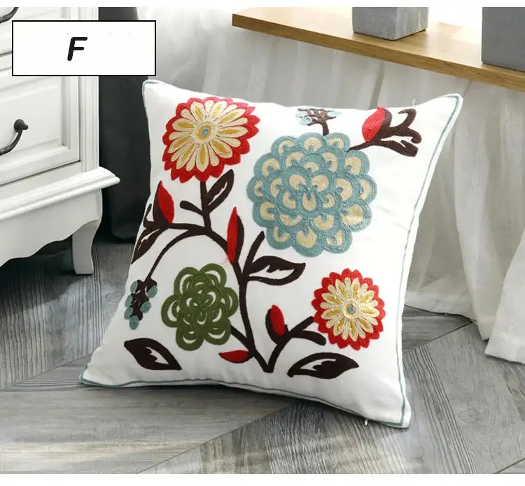 White square ethnic style canvas pillow cover with colorful embroidered flowers on dark brown vine decorbites decor