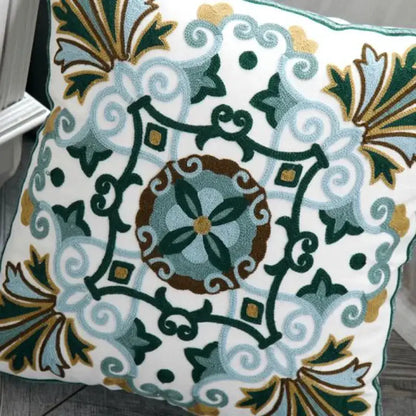 White cushion pillow cover with ethnic style canvas floral embroidery in green blue brown and gold for living room decorbites decor