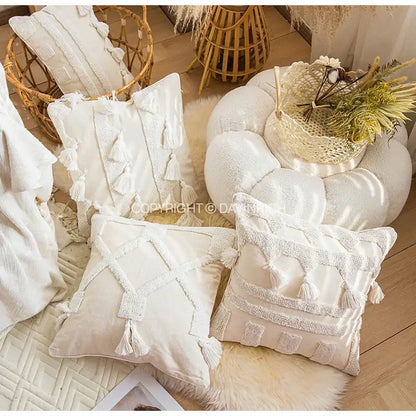 Cream-colored decorbites ethnic tufted cushion case with textured tassels and embroidered geometric patterns for living room decor