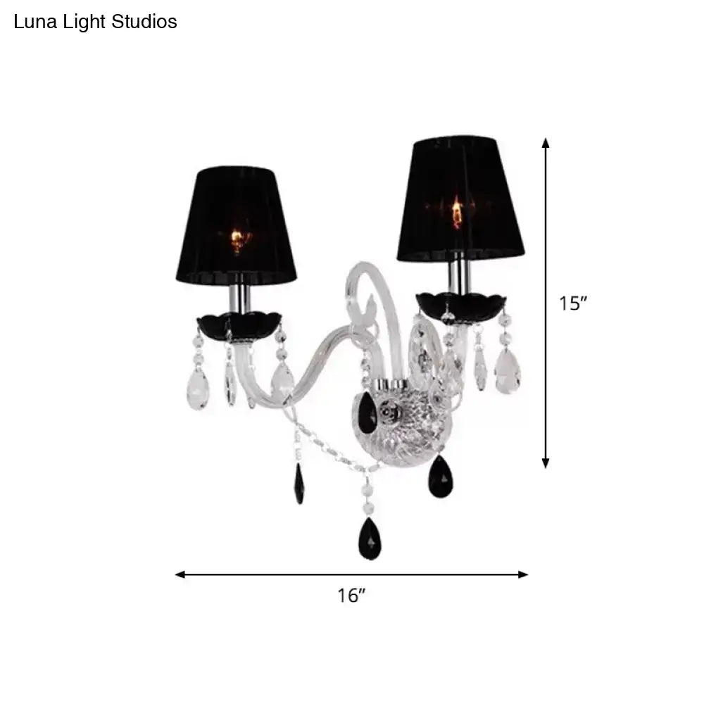 Elegant european black crystal two-light wall sconce with pleated linen shade and ornate central base for bedroom use