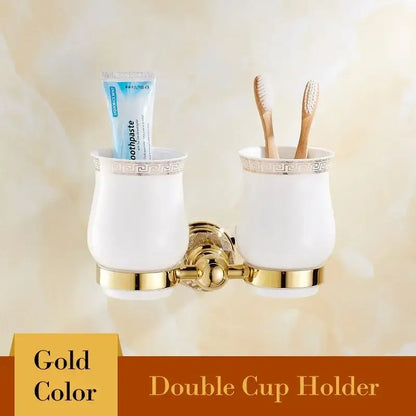 European gold and crystal bathroom towel rack with gold double cup holder and white ceramic cups with greek key decorbites crystal bathroom