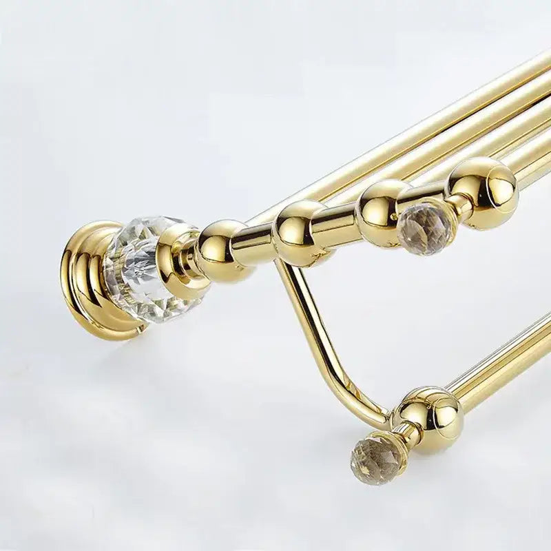 European gold and crystal bathroom towel rack with crystal bathroom towel accents and spherical decorative beads