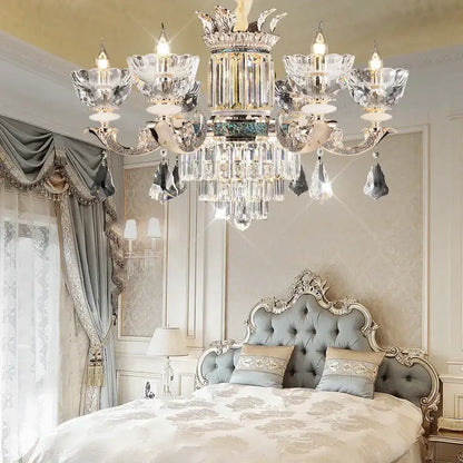 Opulent duplex european crystal chandelier with silver-toned metalwork and intricate crown-like detailing for staircase lighting