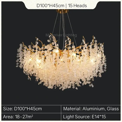 A gold tree branch chandelier with 15 illuminated glass crystal blossoms on an aluminum frame for dining room decorbites gold tree