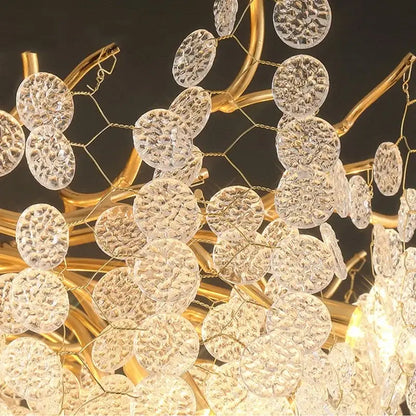 A european style gold tree branch chandelier with clear textured glass discs on a wire mesh frame for dining room decorbites gold tree