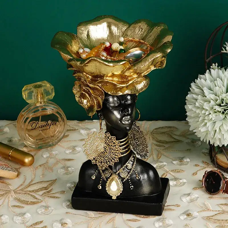 Black african woman resin storage figurine with golden leafy headdress and intricate jewelry for living room decor