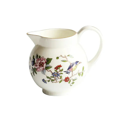 A white ceramic coffee set pitcher with exquisite hand-painted floral and bird design gold-trimmed for decorbites tea