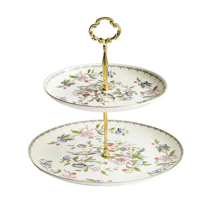 Elegant two-tier porcelain dessert stand with floral and bird motifs in pastels and polished gold handle for decorbites tea set