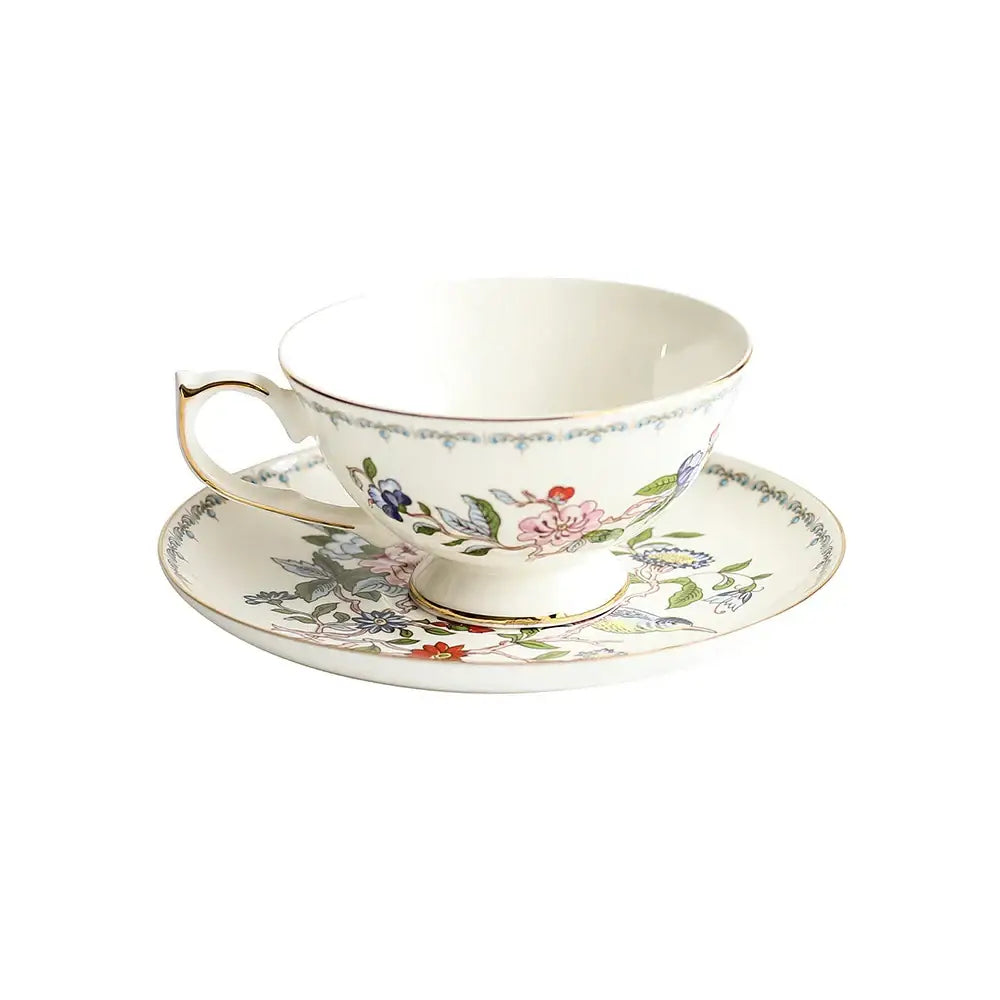 Exquisite set of white porcelain coffee set decorated with delicate pink blue green floral patterns and gold trim