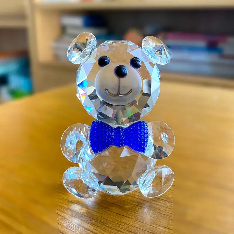 Faceted clear crystal teddy bear figurine with black bead eyes nose and vibrant blue bow tie for bedroom decor