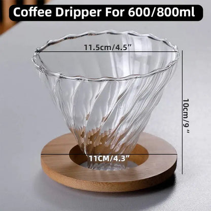 Faceted dark tinted diamond glass coffee carafe with a clear glass filter cup featuring a twisted ribbed design on wooden base