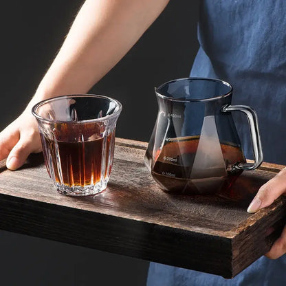 Faceted dark tinted diamond glass coffee carafe with clear glass pourer handle and filter cup measurement markings