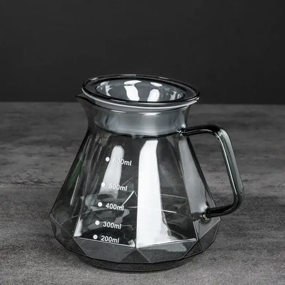Faceted dark tinted diamond glass coffee carafe with black handle and filter cup for kitchen use