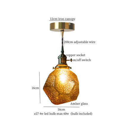 A warm amber faceted glass pleats led pendant light with brass hardware for dining room pendant lights