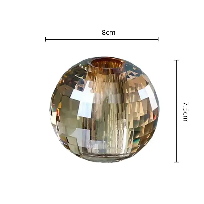 Faceted amber-tinted glass aroma diffuser with smooth reflective surface and geometric base for bedroom decor