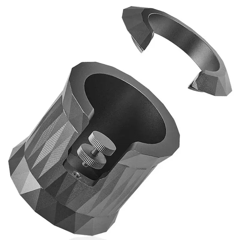 Faceted matte black metal espresso portafilter holder with textured interior and adjustable screw mechanism for secure use