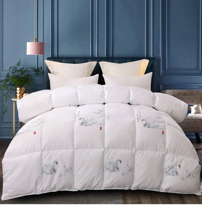 White goose down quilt with white quilted comforter featuring elegant black and gray swan illustrations and red seals