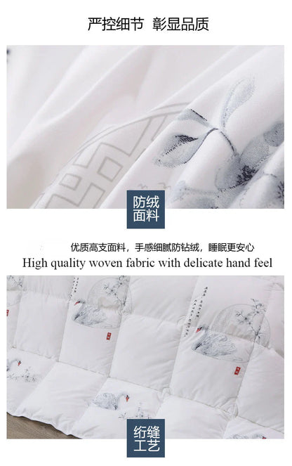 White goose down quilt with delicate gray floral embroidery on soft high-quality woven fabric for comfortable winter bedding