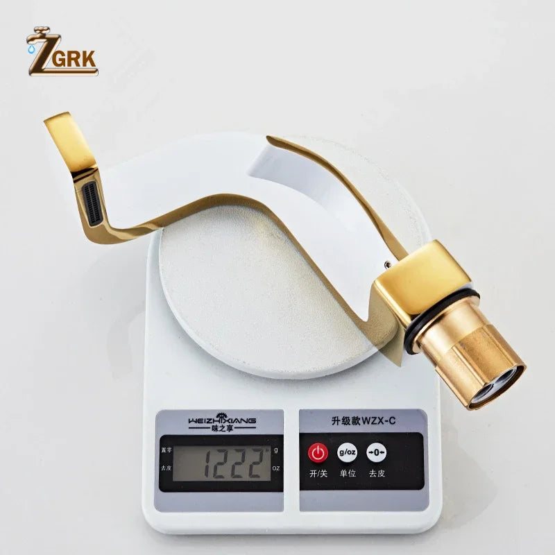 Gold-finished single hole brass waterfall faucet with sleek curved spout and durable housing material for bathroom use