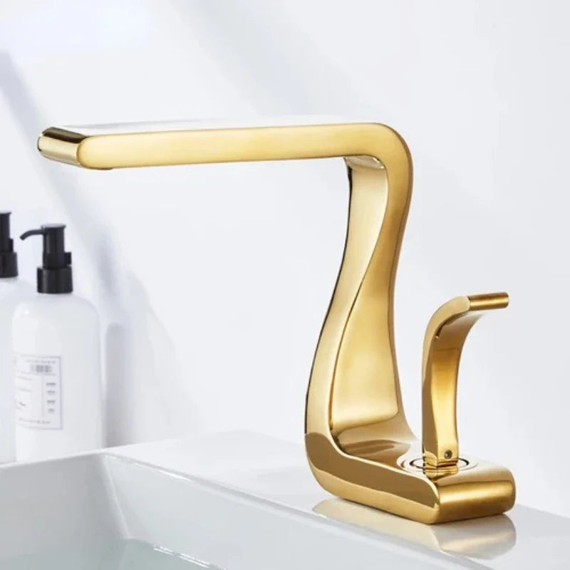 Gold-colored single hole bathroom faucet with sleek curved design and brass housing material for hot and cold water mixing
