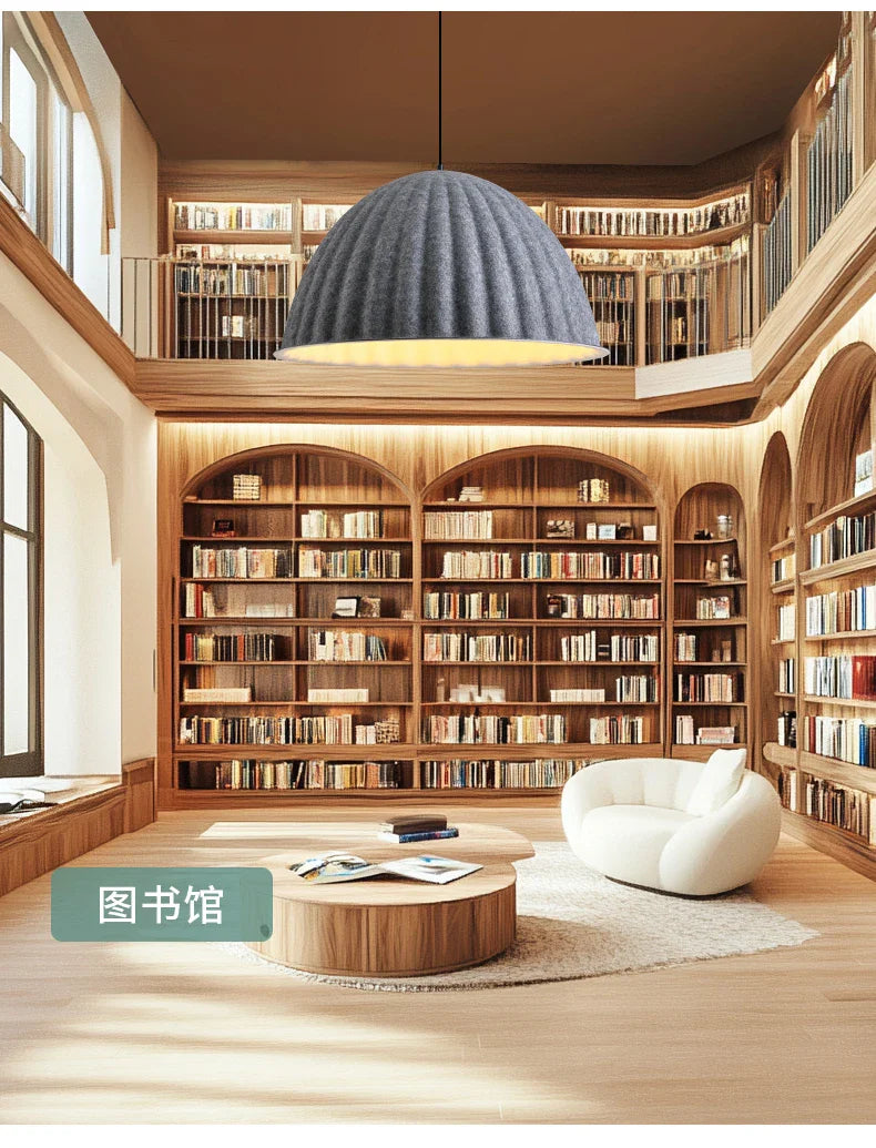 A modern dome-shaped felt pendant light with a textured gray fabric shade for acoustic office use hangs from ceiling