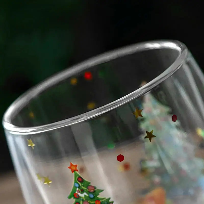 Clear double wall glass mug with festive christmas tree and gold red green star decorations for kitchen decor