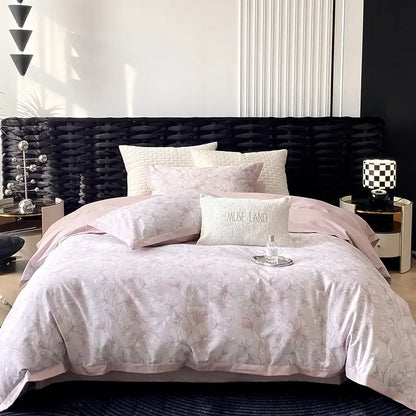 Pink floral-patterned egyptian cotton bedding set with matching pillows and white accent pillow mause land print