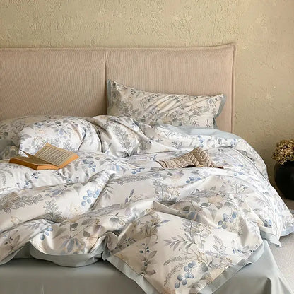 Floral beige egyptian cotton bedding set featuring a soft cream cotton bedding set with muted blue and gray botanical print