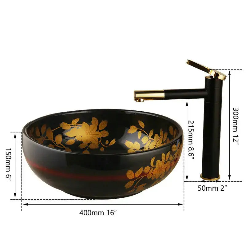 Black ceramic vessel sink with gold leaf floral pattern and red accent band paired with swivel brass faucet
