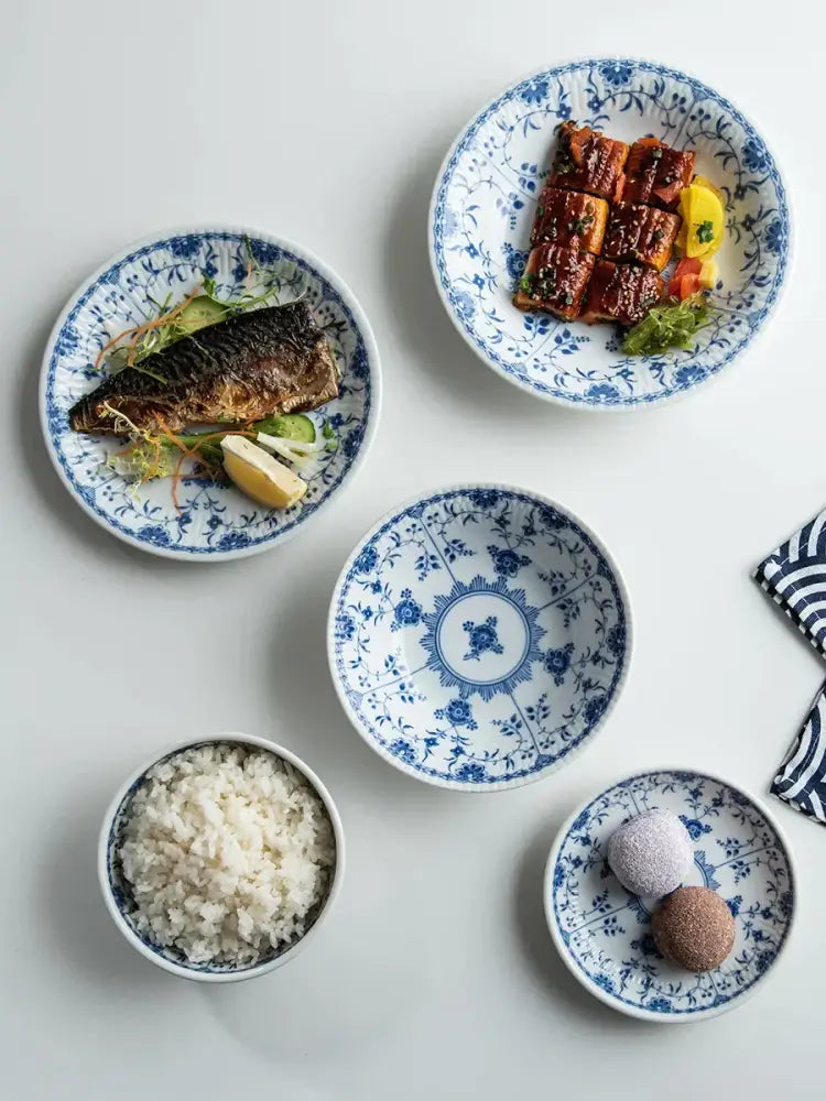 Blue and white ceramic dining set plates with intricate floral patterns for elegant dining room use