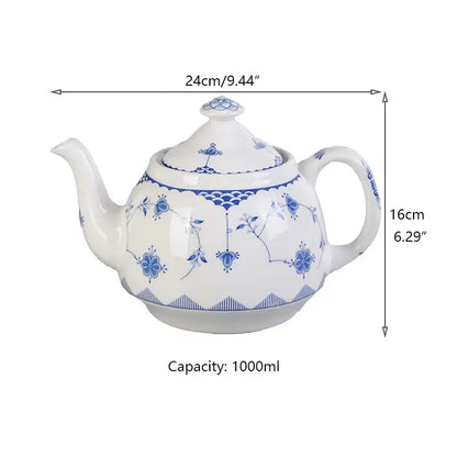 A classic white porcelain teapot with blue floral and wave patterns complements decorbites ceramic dinner plate designs