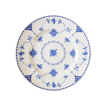 Floral blue and white ceramic dinner plate with intricate vine patterns and scalloped edge by decorbites ceramic dinnerware