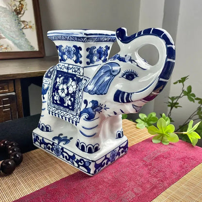 White and blue porcelain elephant statue with intricate floral patterns for living room decor by decorbites elephant statue