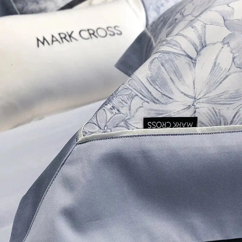 Gray floral-patterned satin pillowcase with subtle sheen and embroidery from floral blue and white egyptian cotton bedding sets
