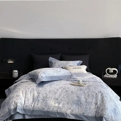 Light blue floral-patterned egyptian cotton bedding set with satin trim and matching pillowcases for bedroom linens