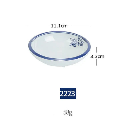 White imitation porcelain bowl with blue floral design and rim from floral blue and white imitation porcelain dinner set