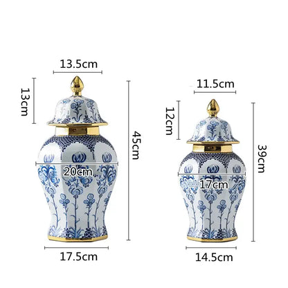 Two elegant blue and white porcelain general jar vases with gold-trimmed lids and intricate floral patterns for living room decor