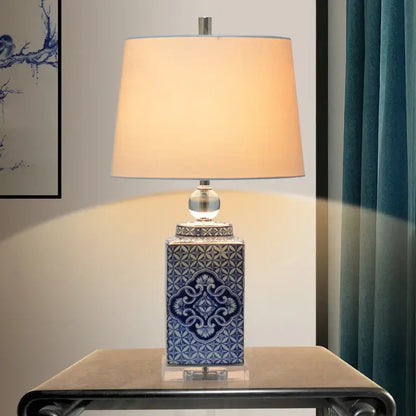 Blue and white ceramic table lamp with intricate floral patterns and beige fabric shade for bedroom decorbites white porcelain