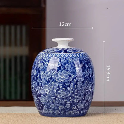 A glossy blue and white porcelain tea pot storage container with intricate floral patterns and traditional chinese craftsmanship